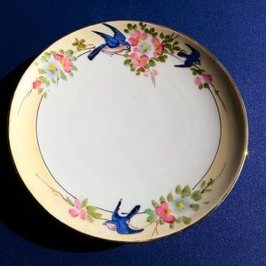 Porcelain Hand-Painted Dessert Plate with Blue Bird Motif and Cream Rim